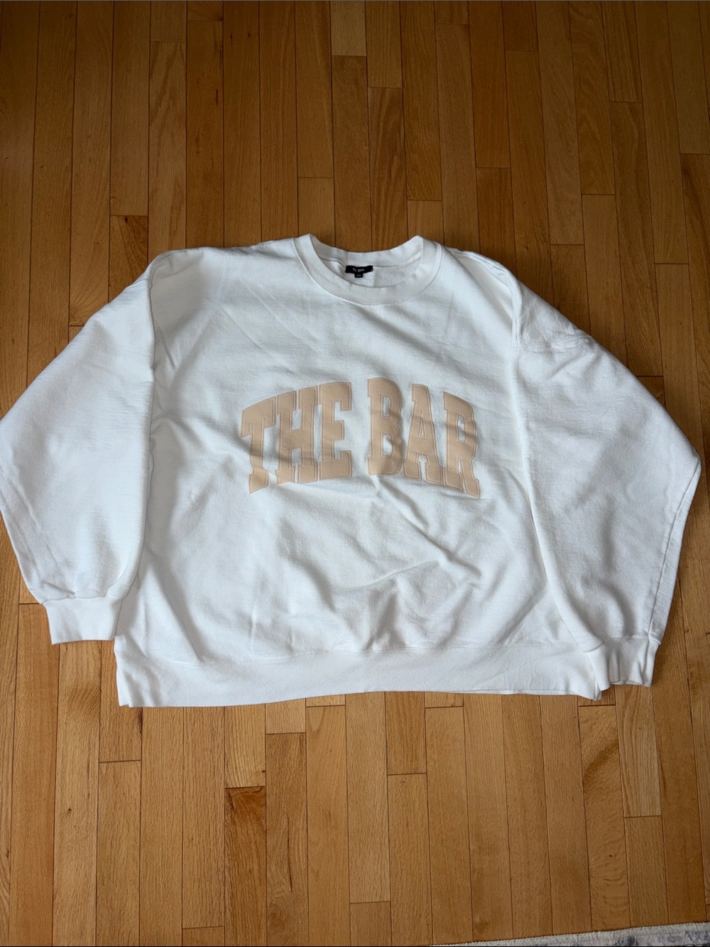 The Bar White Crewneck Sweatshirt with Beige 'THE BAR' Chest Logo